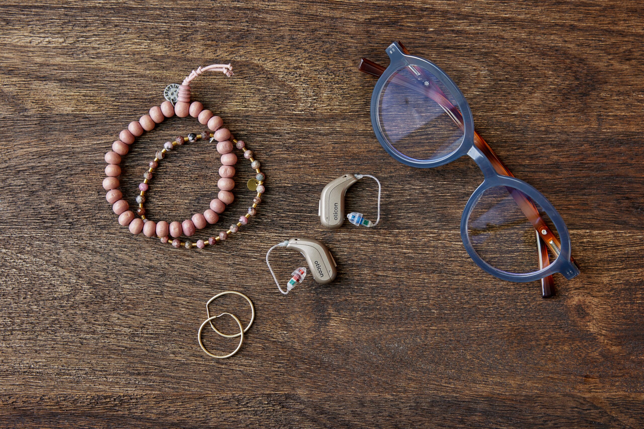 Oticon_Intent_Still_Life_miniRITE_Jewelry_Glasses_MS_0284-scaled (1)