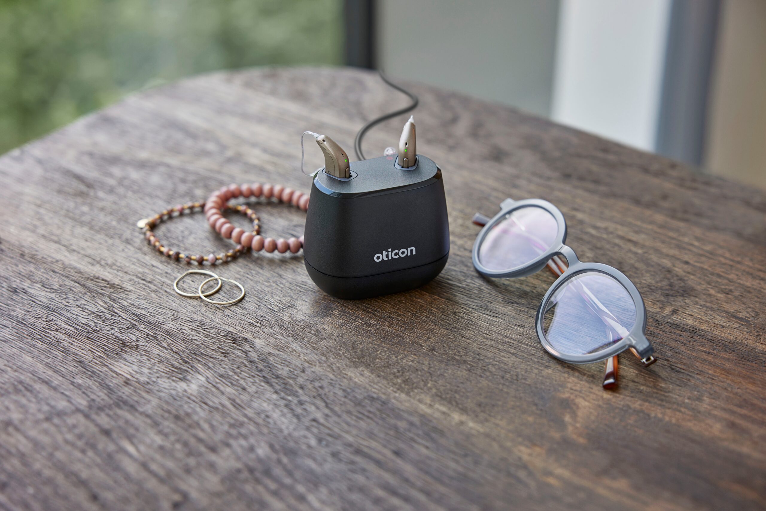 Oticon_Intent_Still_Life_miniRITE_Jewelry_Glasses_MS_0435b-scaled (1)